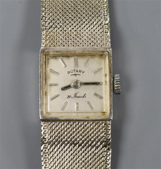 A ladys 9ct white gold Rotary manual wind wrist watch on integral 9ct white gold bracelet.
